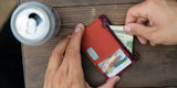 Chums Bandit Zip Wallet in the colours Rust and Burgundy (with cards and money in)