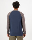 Mons Royale Icon Merino Raglan Long Sleeve in the colour Midnight Iron shown from the back on a man
