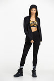 Model wearing Mons Royale Merino Winter Leggings in black.