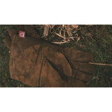 Robens Fire Gloves next to some wood shavings