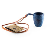 Kupilka Shot Cup 50ml in the colour blueberry showing leather lanyard