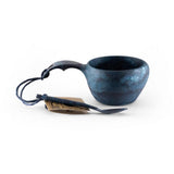 Kupilka Classic Cup 210ml in the colour blueberry with a teaspoon (not included).