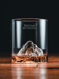 Gilded Peaks Tryfan Glass Tumbler shownhalf full with alcohol
