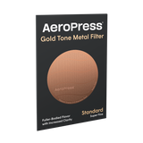 Aeropress Superfine Filter in the colour Gold, shown in packaging