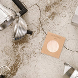 A Cafe Concetto Moka Filter Disc - Superfine 57.5mm shown in packaging