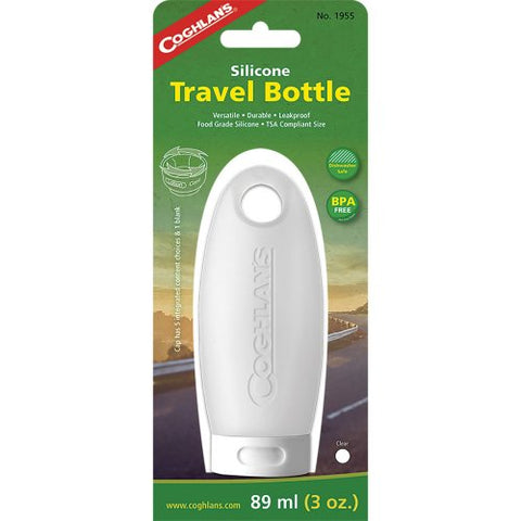 Coghlans Silicone Travel Bottle in clear in green packaging with yellow font. Graphic of road leading into sunset.