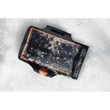 Fidlock Armband dry bag in Black/Transparent colour shown in the snow with snowy background