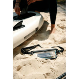 Fidlock Dry Bag – Sling Bag in the colour Black/Transparent at the beach