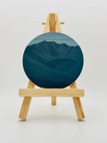 Gilded Peaks Helvellyn coaster shown from the front on an easel