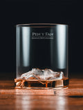 Gilded Peaks Pen y Fan Glass Tumbler shownhalf full with alcohol