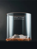 Gilded Peaks Pen y Fan Glass Tumbler shownhalf full with alcohol