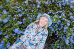 KAVU Cavanaugh Fleece in the colour spinbloom amongst the blooms