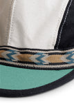 KAVU Organic Strapcap Hat in the colour Forest Mix, shown up close from the front
