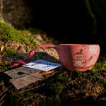 Kupilka Moomin little my in red - Classic Cup 210ml shown on the forest floor