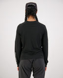 Mons Royale Womens Tarn Merino Bike Wind Jersey in the colour Black, shown from the back on a model