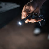 Nebo Columbo Key Chain shown in a hand with the light on 