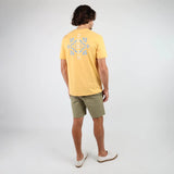 Back of Oxbow TABULA Tee-shirt in Kumquat on man in green shorts