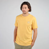 Oxbow TABULA Tee-shirt in Kumquat on man with hands in pockets