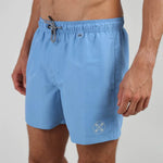 Oxbow VALENS Shorts , Teahupoo close up on man showing white logo and black and white draw string