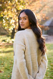 Pachamama Bird Sweater shown from the back, on a model