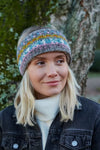 Pachamama Braemar Headband with sherpa fleece lining shown on a smiling model