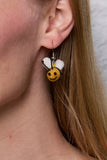 Pachamama Bumble Bee Earrings shown on a model