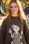 Pachamama Gecko Sweater shown from the front on a woman 