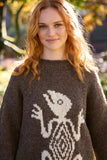 Pachamama Gecko Sweater shown from the front on a woman 