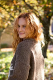 Pachamama Gecko Sweater shown from the back on a woman 