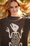 Pachamama Gecko Sweater shown from the front on a woman 