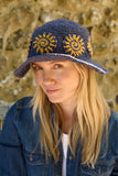 Pachamama Sunshine Hemp/Cotton Sun Hat in the colour Denim, shown on a model