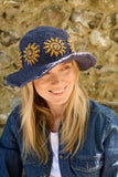 Pachamama Sunshine Hemp/Cotton Sun Hat in the colour Denim, shown on a model