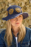 Pachamama Sunshine Hemp/Cotton Sun Hat in the colour Denim, shown on a model