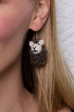 Pachamama Herdi Sheep Earrings shown on an ear