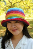 Pachamama Rainbow Cotton Bucket Hat woman looking at the camera