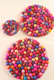 Pachamama Woodstock Pebble Trivet in multicolour shown in various sizes