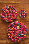 Pachamama Woodstock Pebble Trivet in multicolour shown in various sizes