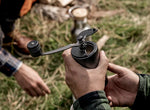 Petromax Hand Coffee Grinder in mans hands ready to grind