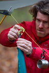 SOTO Gravity Hanger shownbeing attached to a camping line