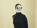 Sinner Thunder X Sunglasses in black blue oil shown on female model. 