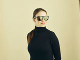 Sinner Thunder X Sunglasses in Matt Black colour shown on a female model