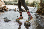Solmate Dogwood Wool Crew Socks crossing a river