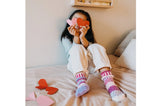 Solmate Lovebug Kids Socks shown on a model's feet
