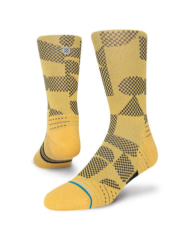 Stance Building Crew Sock in the colour gold shown on a foot shape..