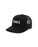 Stance Icon Trucker Hat in the colour black with white logo writing shown from the side