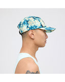 Stance Kinetic Adjustable Ripstop Cap in the colour Teal Camo shown from the side on a man