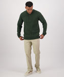 Swanndri Men's Doncaster 1/4 Zip Cable Knit in the colour Hunter Green, shown from the front on a model