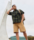 Swanndri Henderson Jacket in the colour Olive Black, shown from the front, on a model
