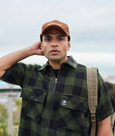 Swanndri Henderson Jacket in the colour Olive Black, shown from the front, on a model