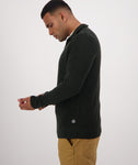 Swanndri Men's Otahu River Quarter Zip in the colour Hunter Green, shown from the side, on a model